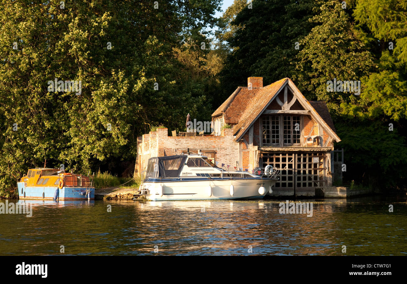 Boats on the river Thames by a boathouse, Wallingford 